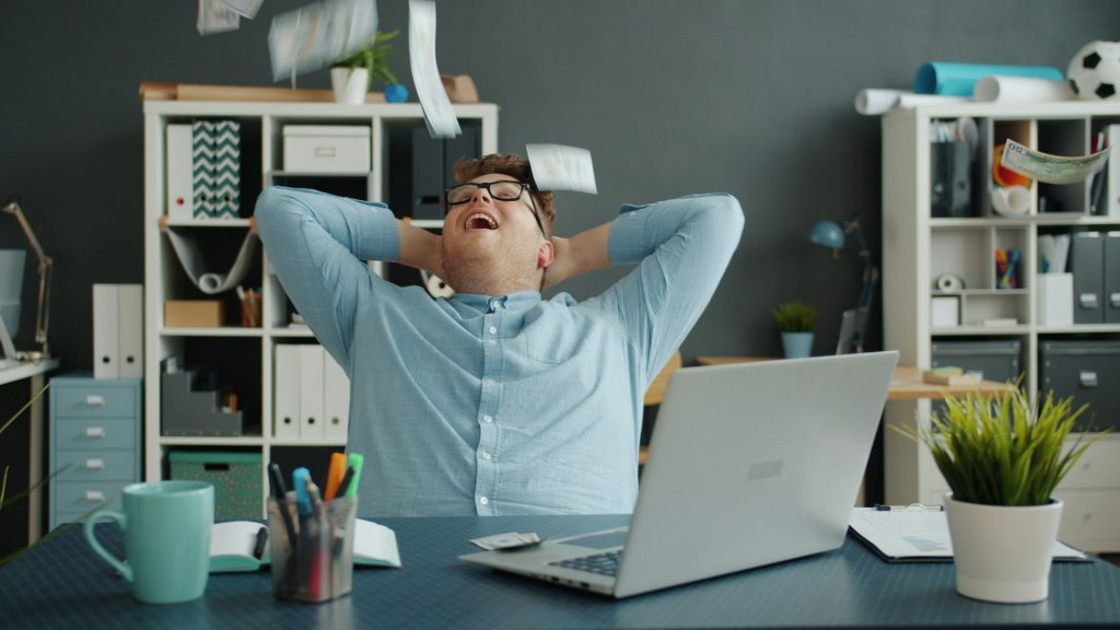 Man at his home office wondering how to start an internet turnkey business on his laptop