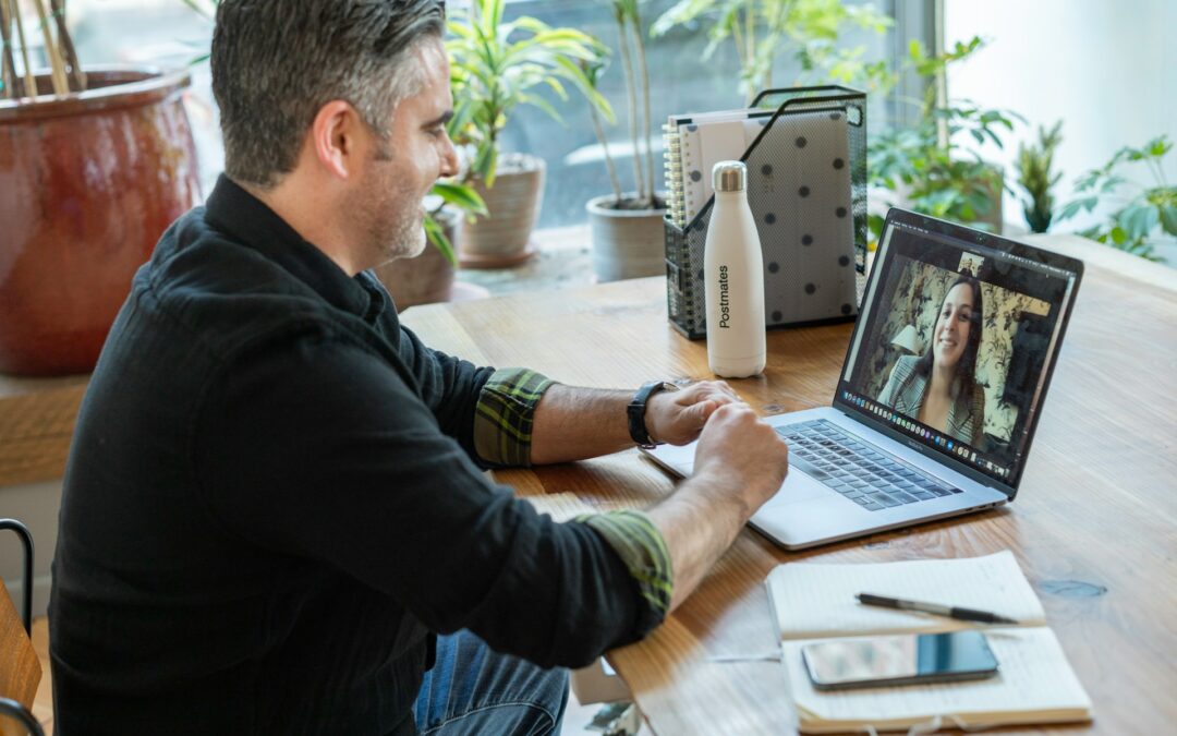Man working in his home office on his online freelance business