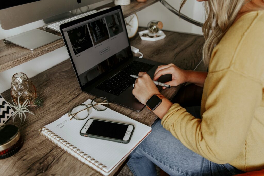 Woman on computer working at home in her home office.