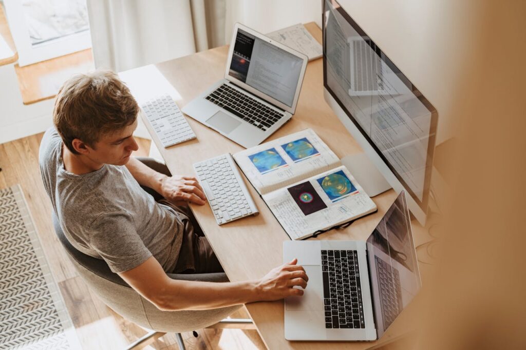 Man working from home on his computer doing data annotation jobs