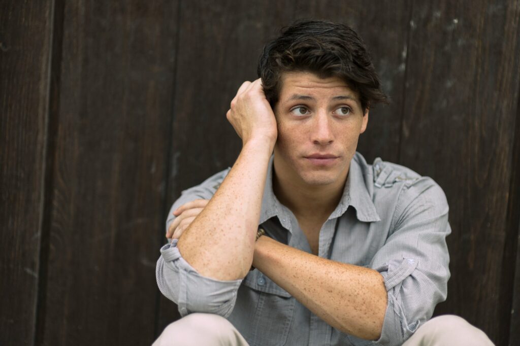 Unhappy graduate jiob seeker waiting for a reply to his applications