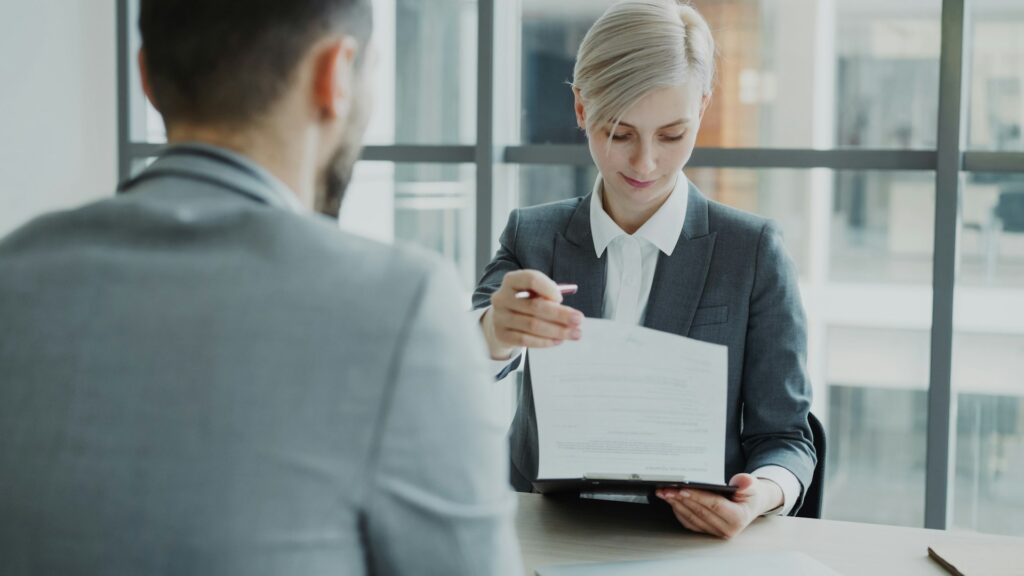 Employer discussing employability skills with a job candidate in an interview
