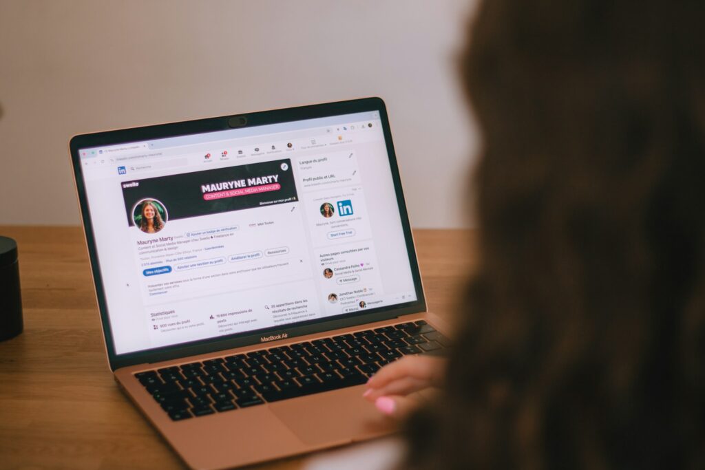 Woman optimizing profile for hidden job market on linkedin