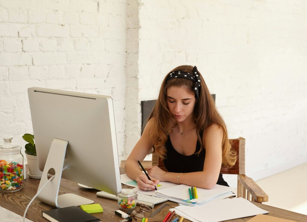 Teenager searching for jobs on a laptop